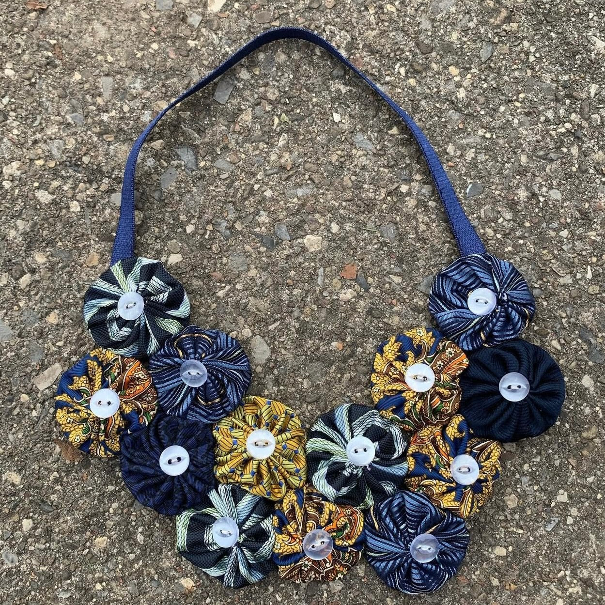 Yo-Yo Tie Necklaces with Pearlized Buttons